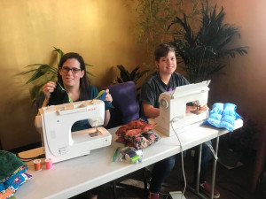 Positive Charge Members sewing therapeutic blankets