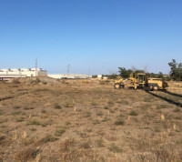 Machinery waiting to build road at Perennial WindChaser site