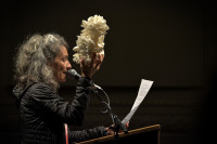 Jan Zuckerman testifying with dead coral at PSCCA Tacoma LNG hearing